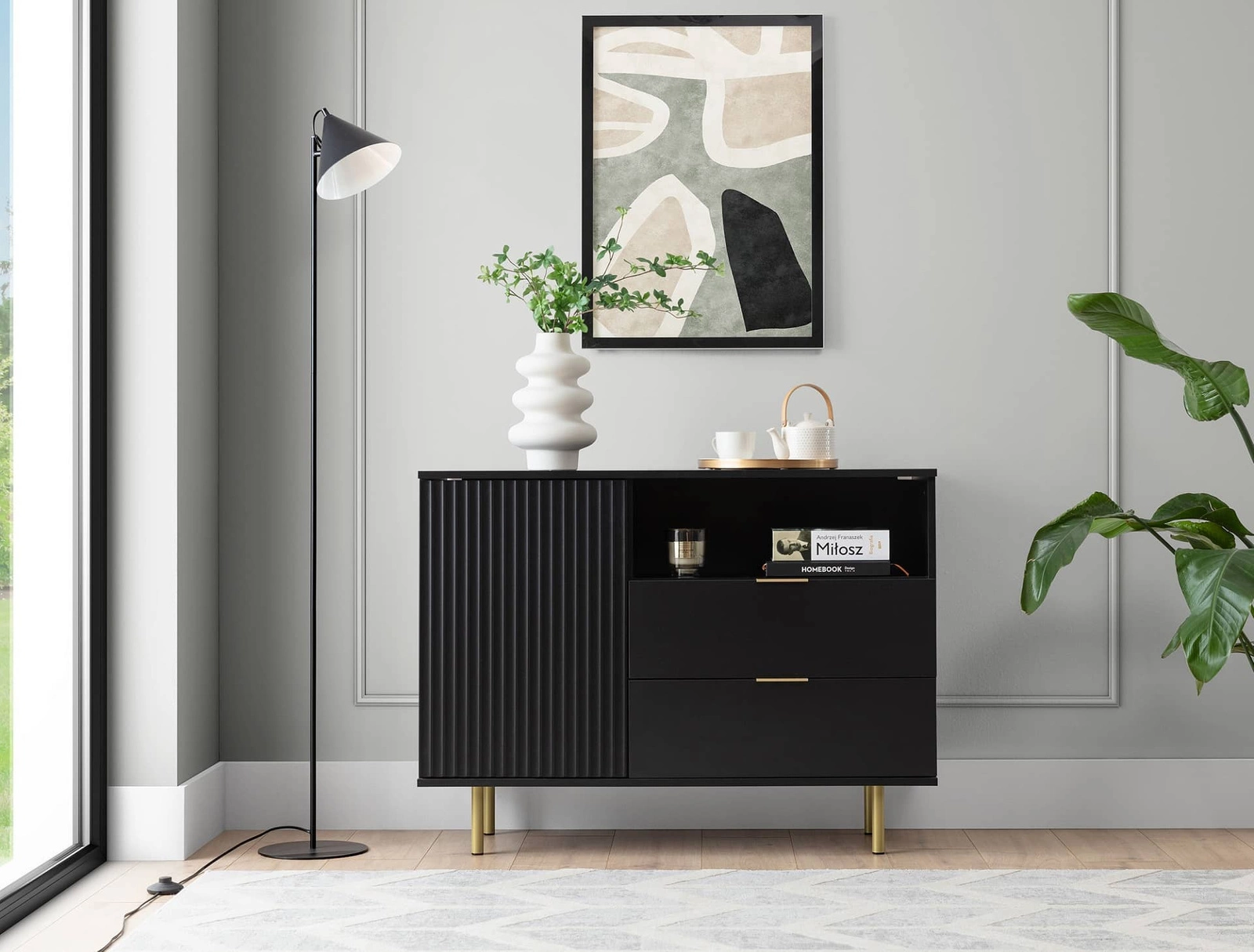 Sula chest of drawers 107 cm black elegant and functional chest of drawers with a decorative grooved front enriched with metal handles